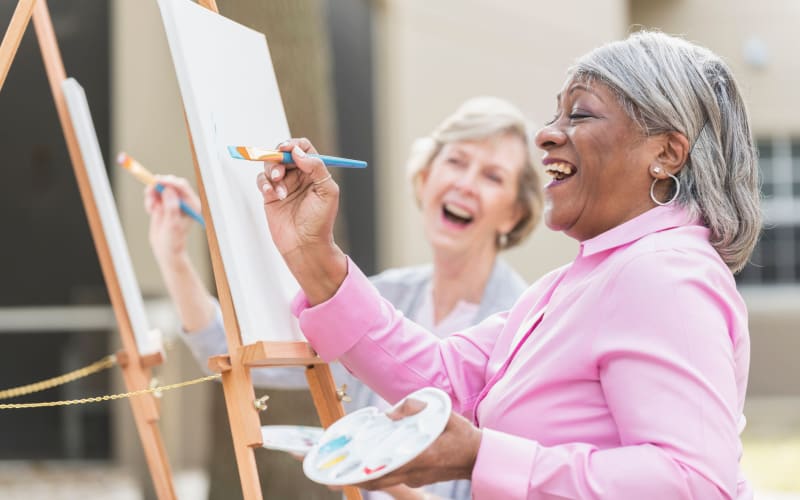 Residents painting outside at All Seasons Oro Valley in Oro Valley, Arizona