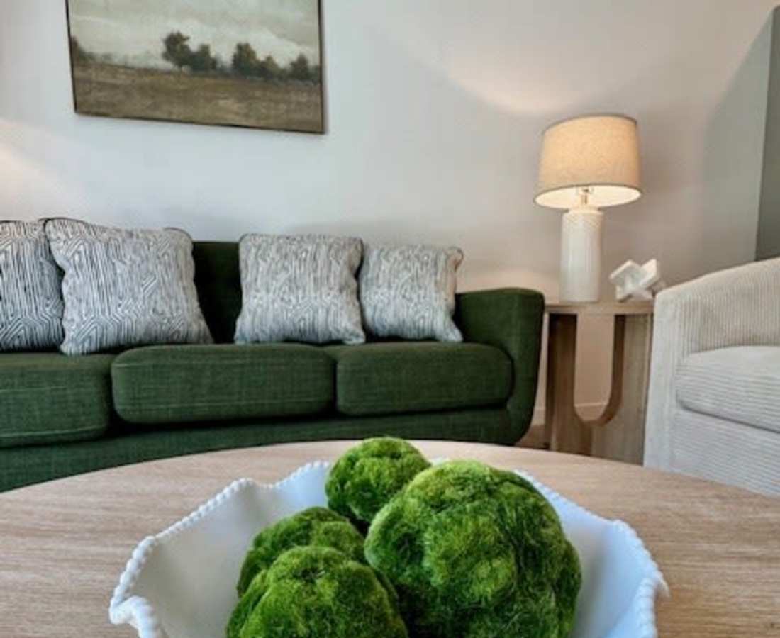 Green decorative balls on a wooden table at Pritchard Park Place in Racine, Wisconsin