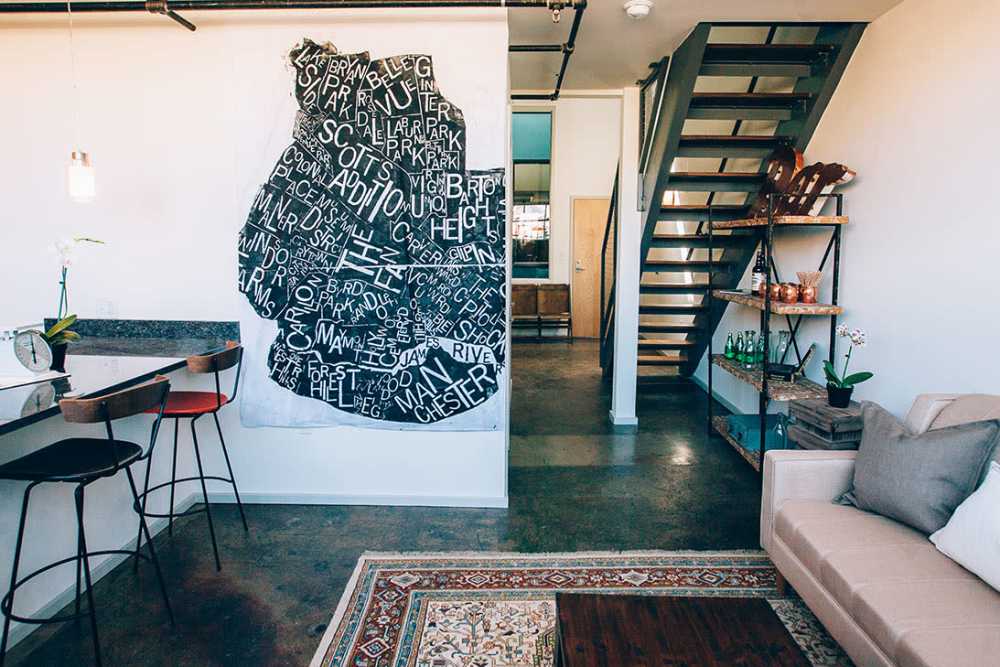 Modern open layout with stylish decor at Courtyard Lofts at Scott’s Addition in Richmond, Virginia