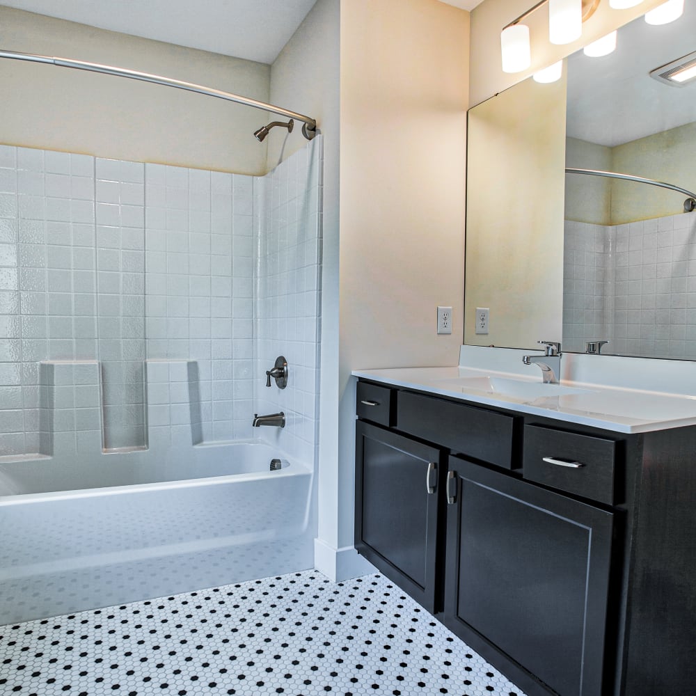 Bathroom with tiled floor at Kettle Point Apartments, East Providence, Rhode Island