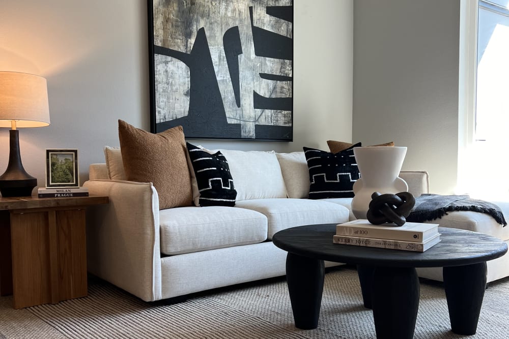 Living room with wood-style flooring at The Highlands at Silverdale in Silverdale, Washington