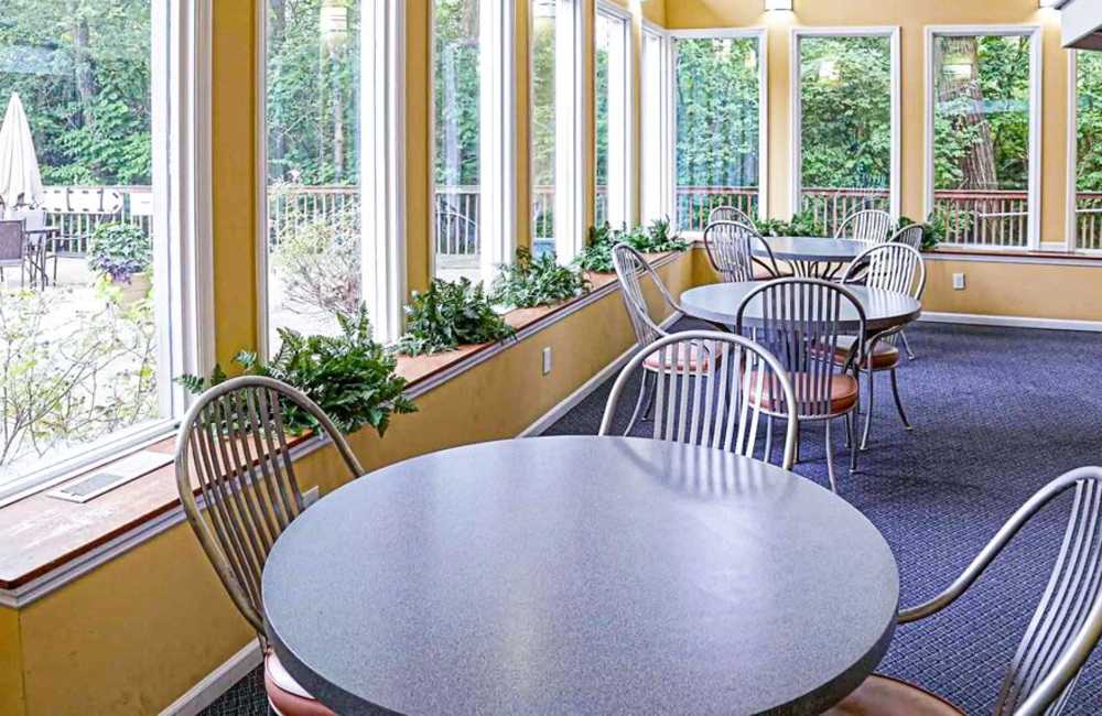 Cozy dining spaces in the community room at Carriage Court in Cincinnati, Ohio
