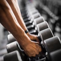 Resident lifting weights at Crossbrook Apartments in Rohnert Park, California