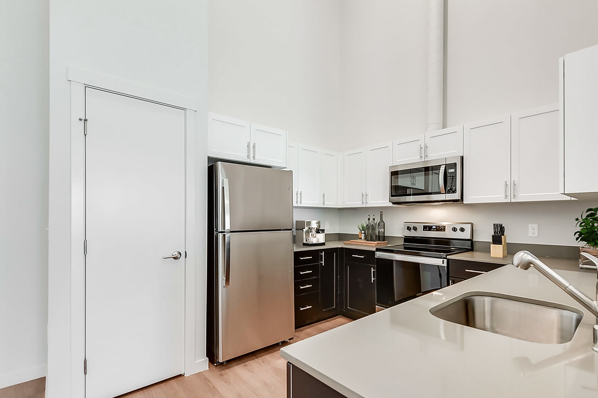 Kitchen with breakfast bar and dining room at Kestrel Park in Vancouver, Washington