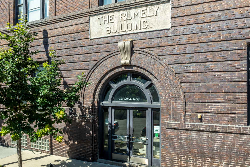 Brick building entrance with arched doorway at Rumely Lofts in Des Moines, Iowa