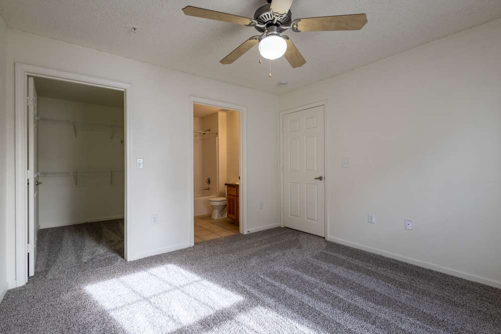 Charming bedroom with plush carpeting and a spacious closet at Adobe Ranch in Borger, Texas.