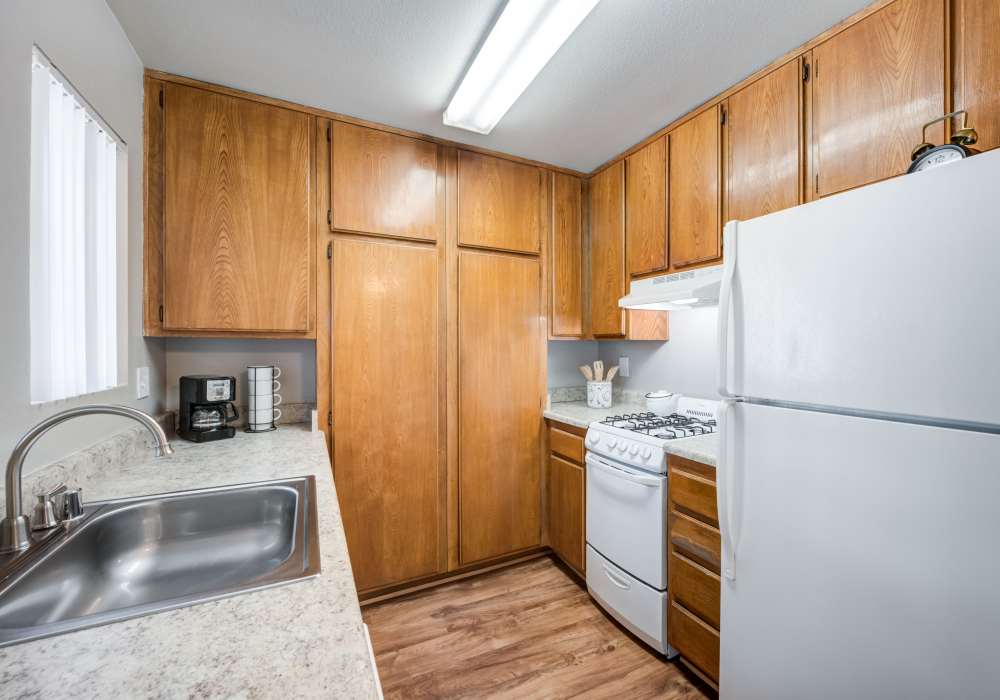 Upgraded kitchen with custom wood cabinetry at The Villas at Rowland Heights in Rowland Heights, California