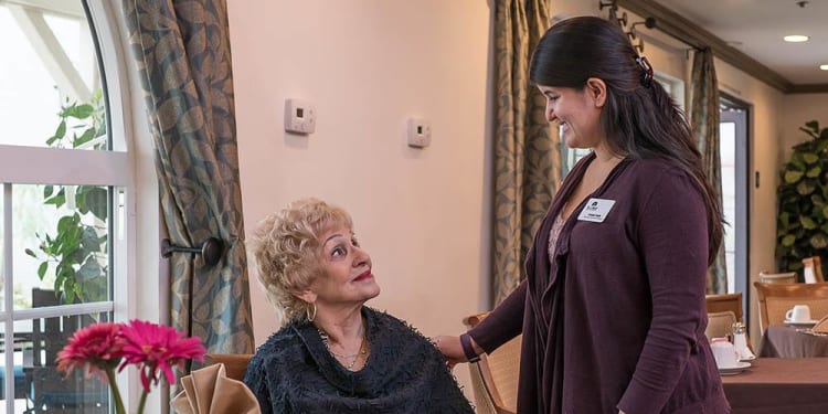 One of our team chatting with a resident at The Commons at Woodland Hills in Woodland Hills, California