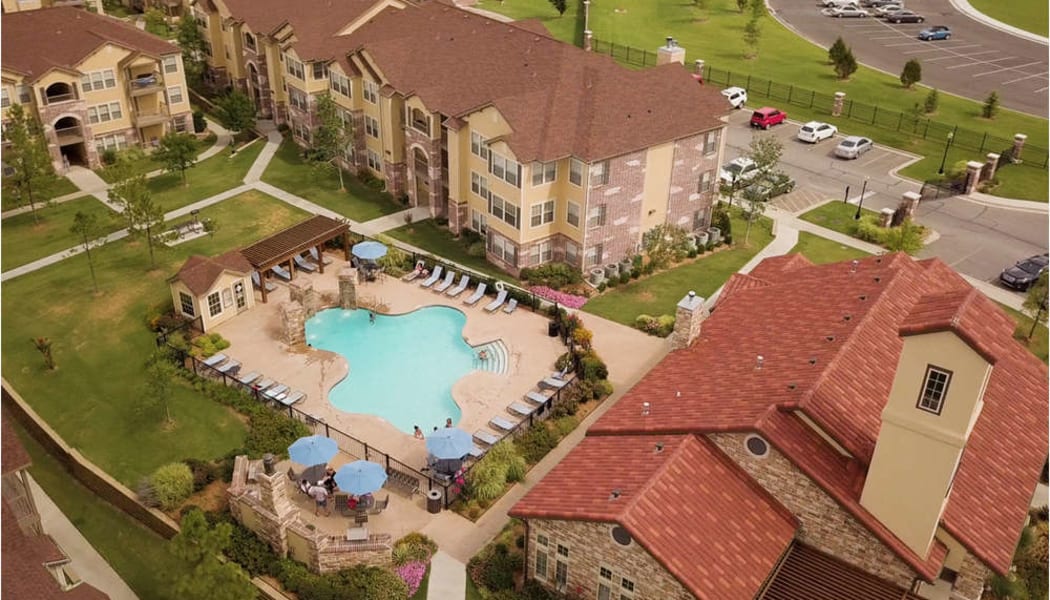 Aerial view of Cascata Apartments's gated community swimming pool in Tulsa, Oklahoma