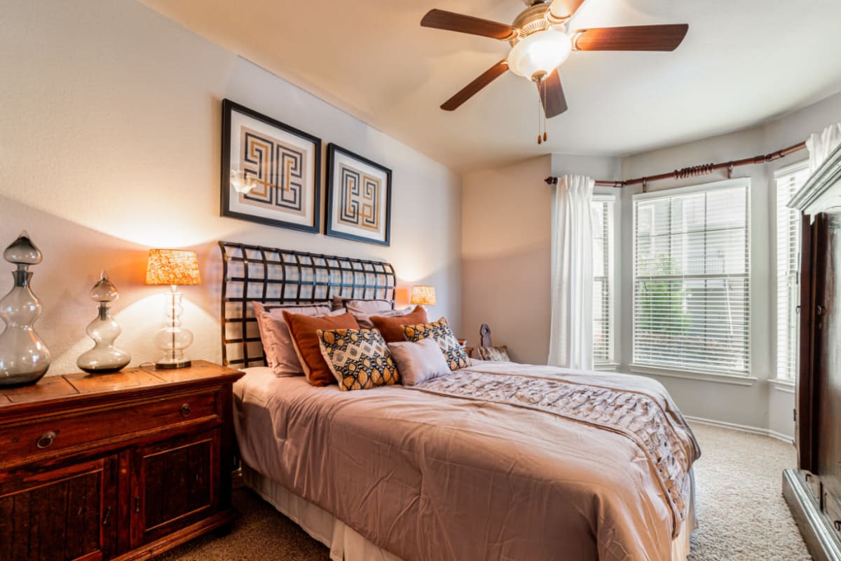 Well-lit spacious bedroom at Marquis at Lantana in Flower Mound, Texas