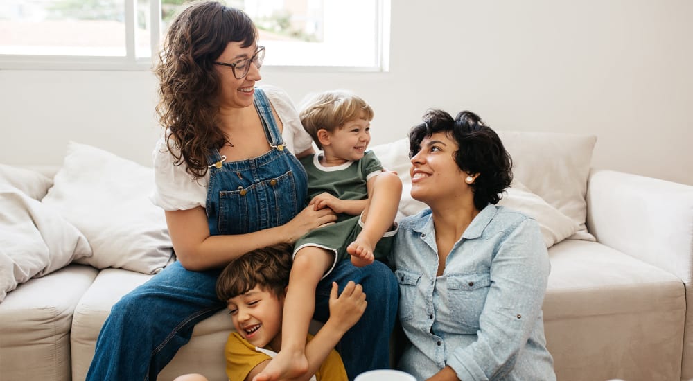 A family enjoys quality time in their apartment at Ravenna Woods in Twinsburg, Ohio