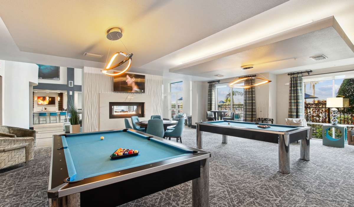 Community clubhouse with billiards table at The Addison on Millenia in Orlando, Florida