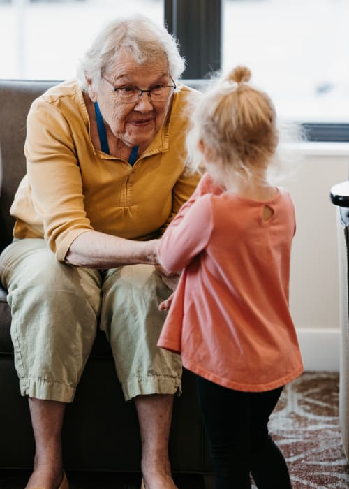 Old woman with a young child at The Pillars of Lakeville in Lakeville, Minnesota