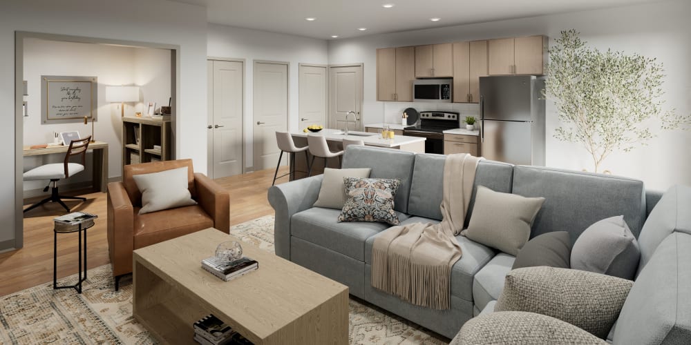 Draped bay windows and modern furnishings in a model home's living area at Veridian in Cincinnati, Ohio 