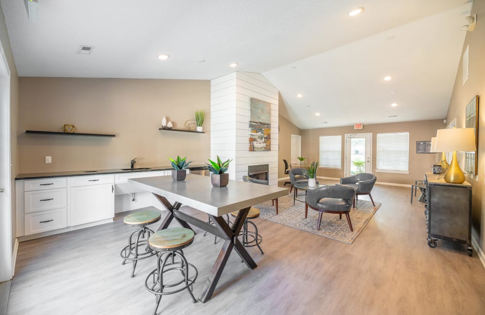 Living room with table dining in a model home at The Village at Brierfield Apartment Homes in Charlotte, North Carolina