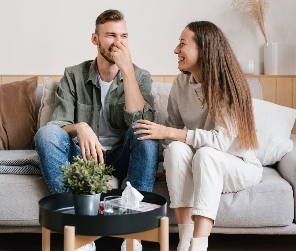 Couple laughing in their home at The Fairways at Jennings Mill in Athens, Georgia