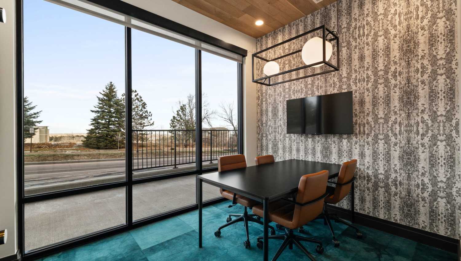 Meeting room in a community clubhouse at The Lock at Flatirons in Broomfield, Colorado