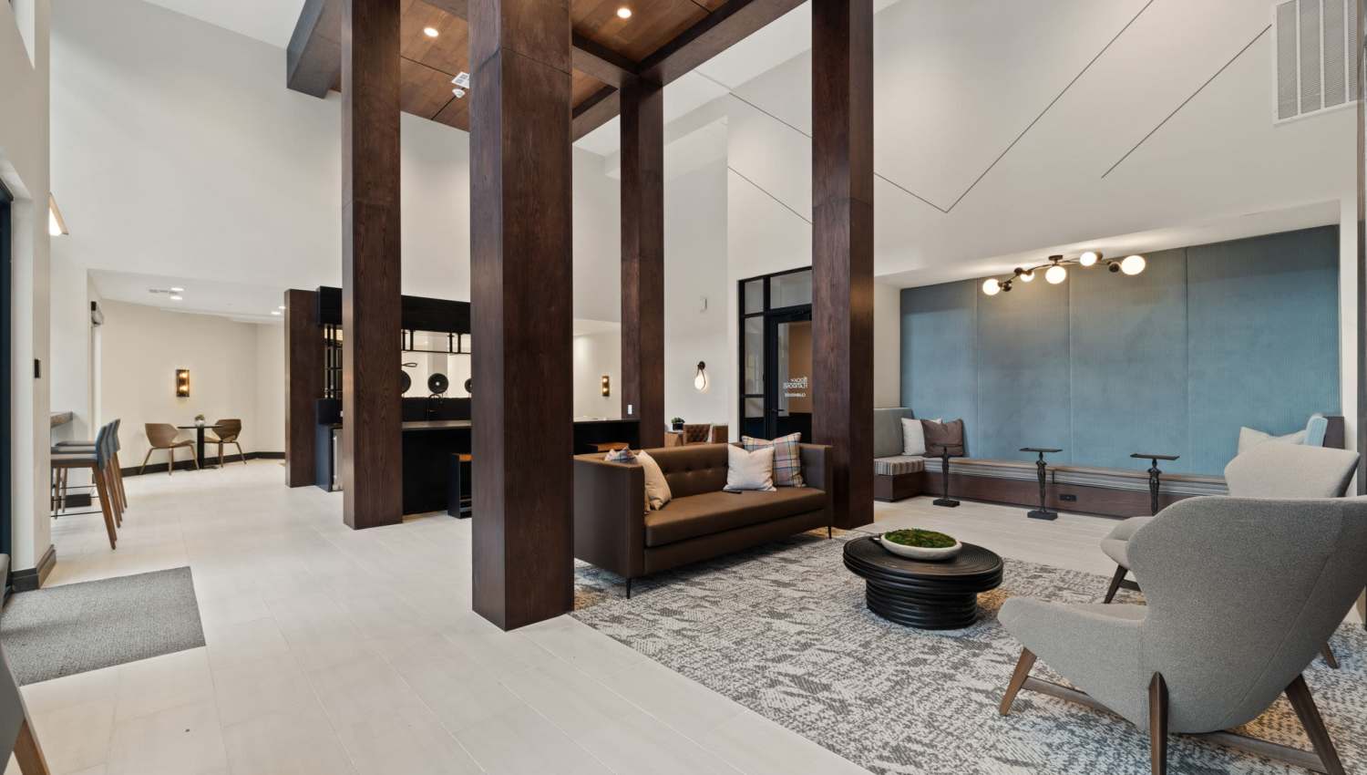 Spacious community clubhouse with couch at The Lock at Flatirons in Broomfield, Colorado