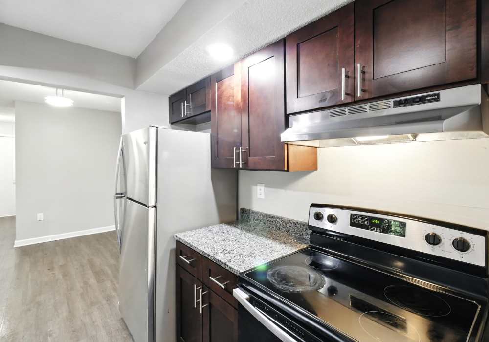 Kitchen with modern appliances and granite countertops at North River Landing in Elkhart, Indiana