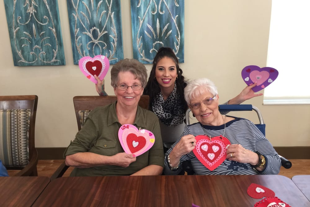 Making Valentine's Day Crafts at Merrill Gardens at Solivita Marketplace in Kissimmee, Florida. 