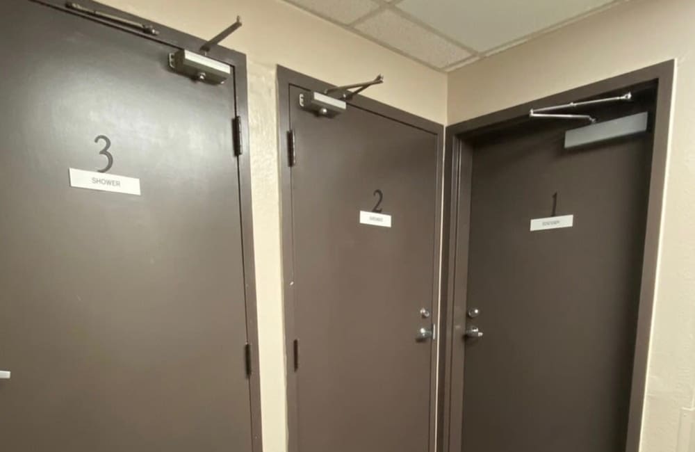 Shared showers at Trolley Court in San Diego, California
