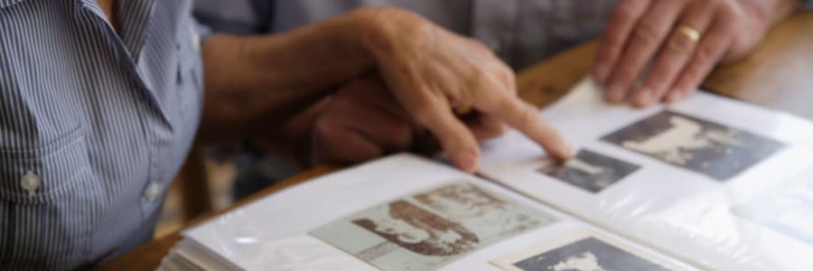 Residents looking at an album at Ingleside Communities in Mount Horeb, Wisconsin