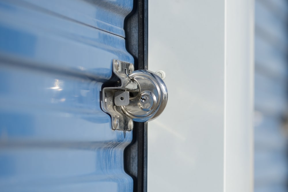 Locked storage units with blue doors at A-American Self Storage