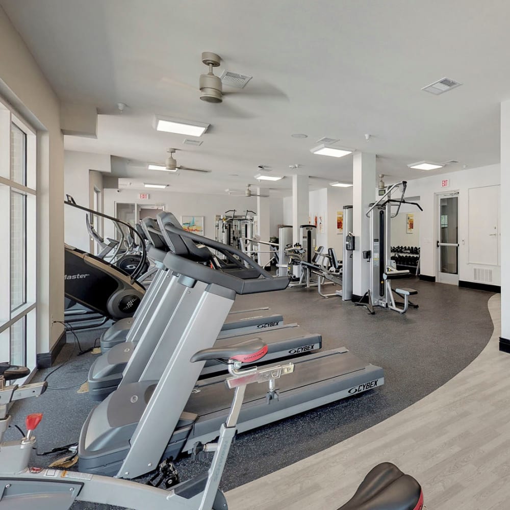 Ample equipment to help you stay in shape in the fitness center at Oaks 5th Street Crossing At City Center in Garland, Texas