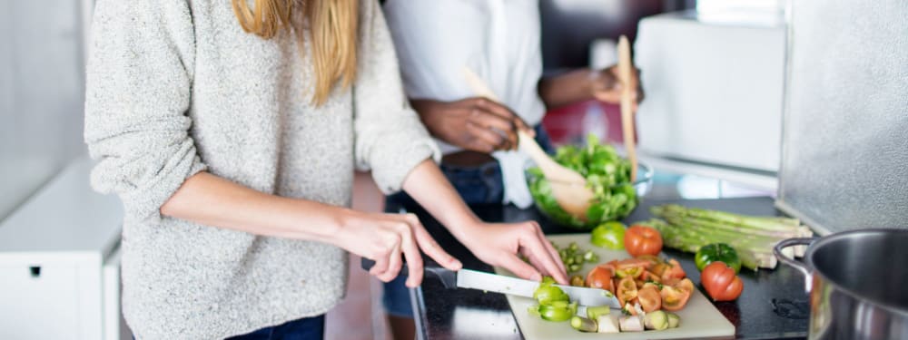 Residents preparing a meal together at The Highlands at Silverdale in Silverdale, Washington