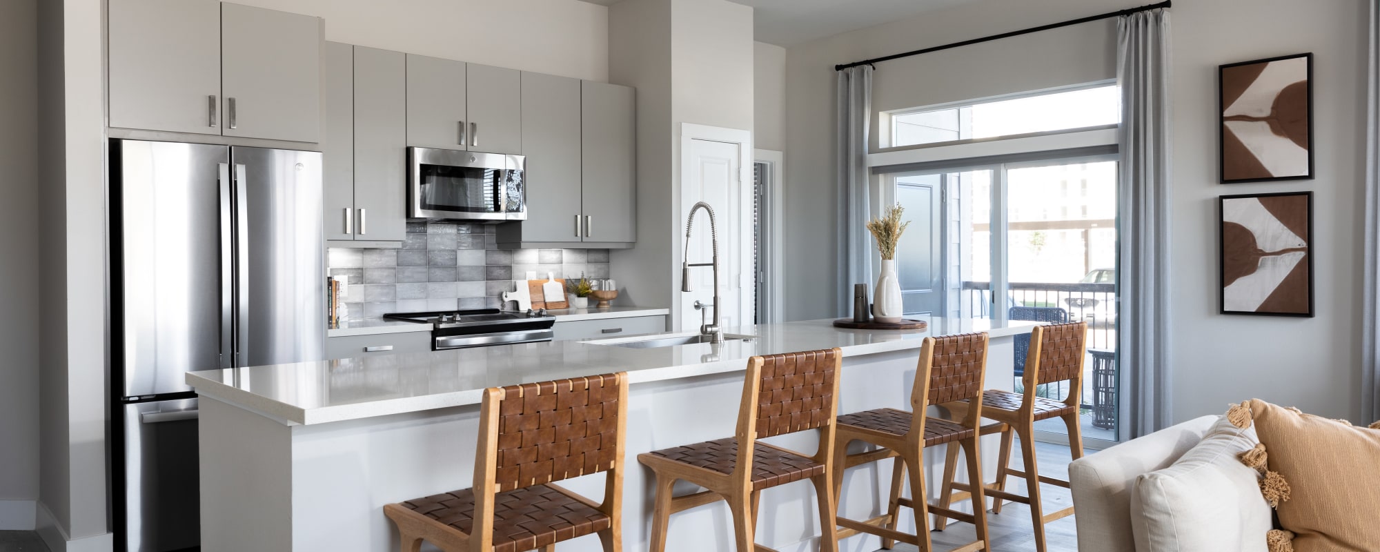 Bright apartment kitchen with counter seating at Bellrock La Frontera in Austin, Texas