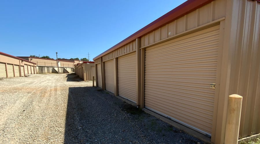 Storage units with blue doors and locks at KO Storage of Paragould in Paragould, Arkansas