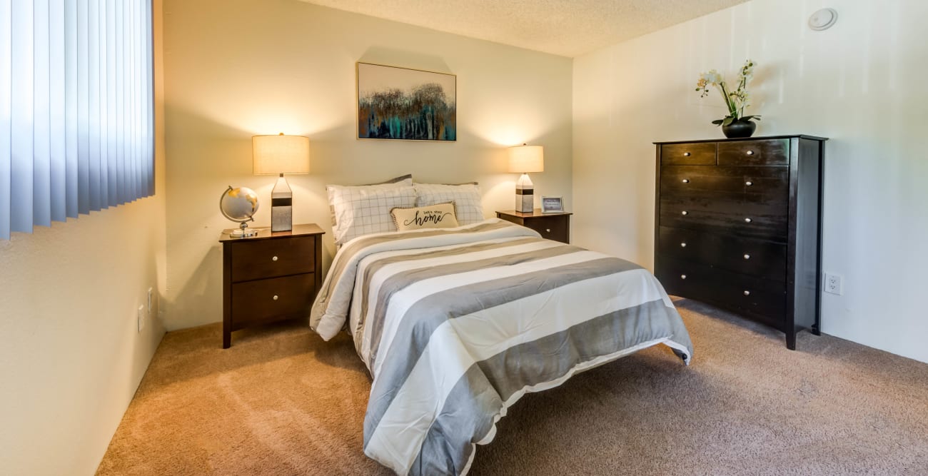 Spacious and carpeted bedroom at The Promenade in Van Nuys, CA