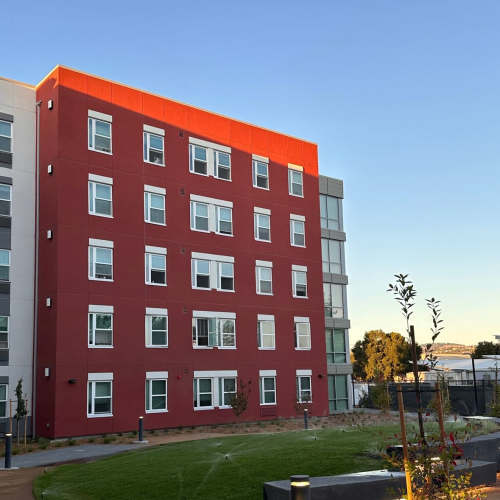 Apartment buildings view with garden area at Polly O'Meara Doyle Hall in Santa Rosa, California