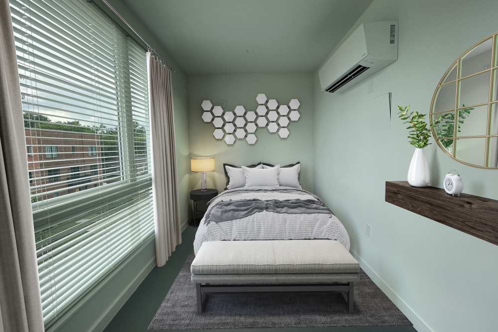 Bedroom with queen-size bed, couch and large windows at Martin Flats in Nashville, Tennessee