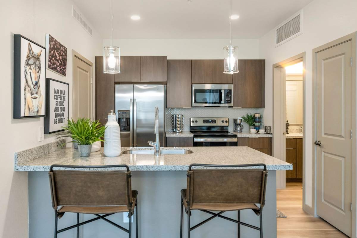 Gourmet kitchen with stainless-steel appliances at Hangar at Thunderbird, Glendale, Arizona