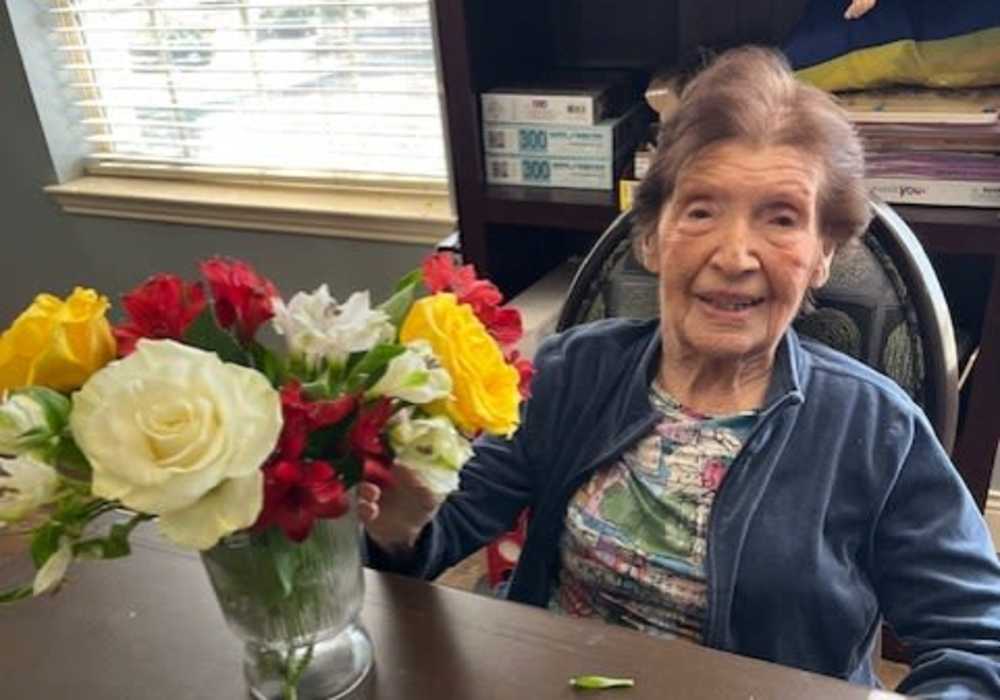 Resident with a flower vase at Truewood by Merrill, Keller in Keller, Texas