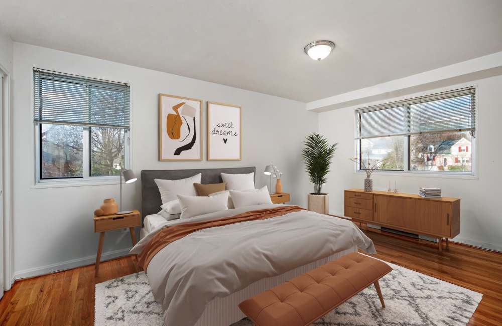 Bedroom with wood style flooring at Bradley View Apartments in Chevy Chase, Maryland