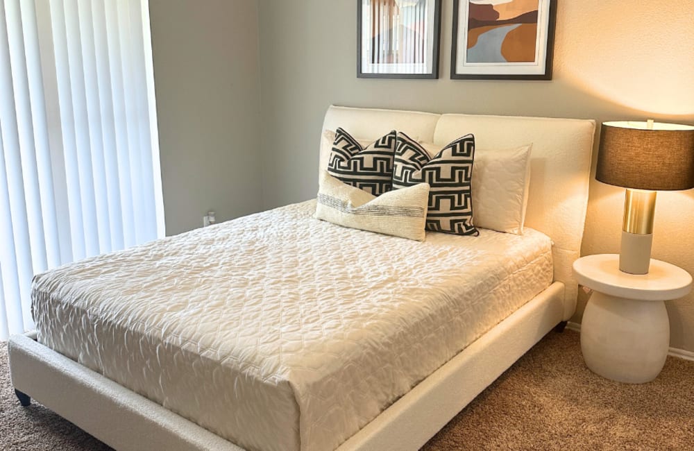 A bedroom of the apartment home at Walnut Ridge in Arlington, Texas