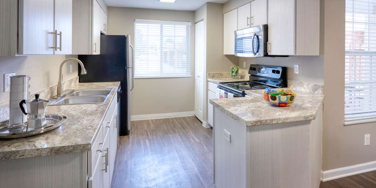 Well organized kitchen in an open floor plan at Villas at Homestead Apartments in Englewood, Colorado