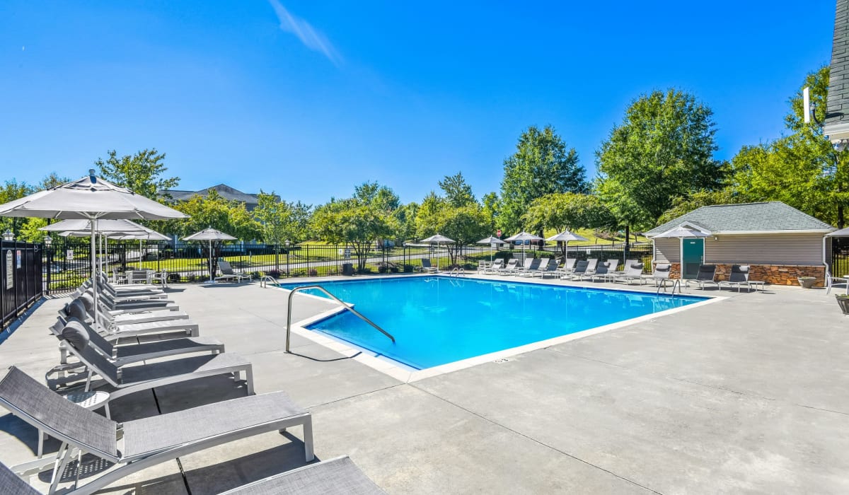 Swimming pool with lounge chairs at Ashley Court Apartments, Charlotte, North Carolina