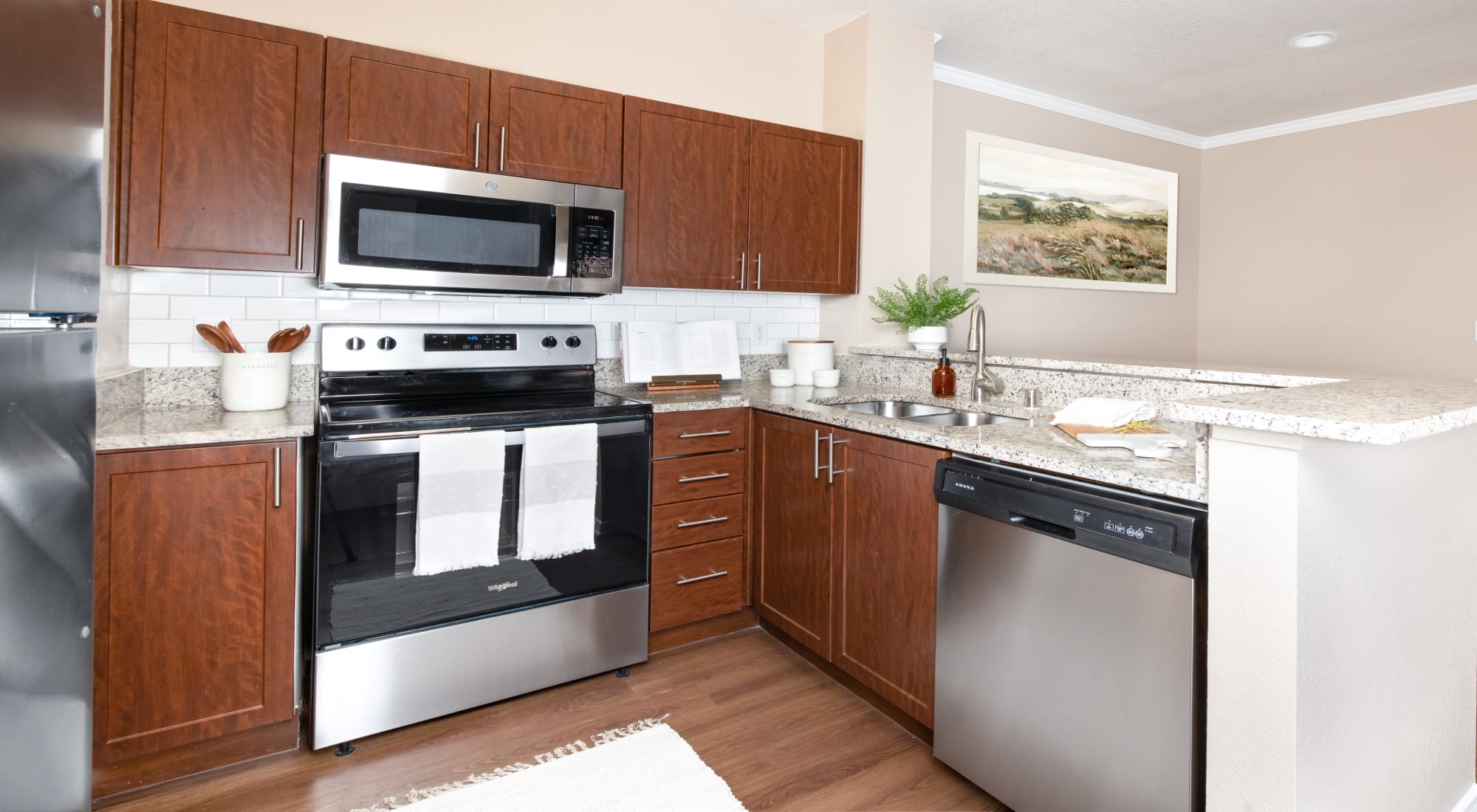 Kitchen with stainless steel appliances at Crescent Cove at Lakepointe