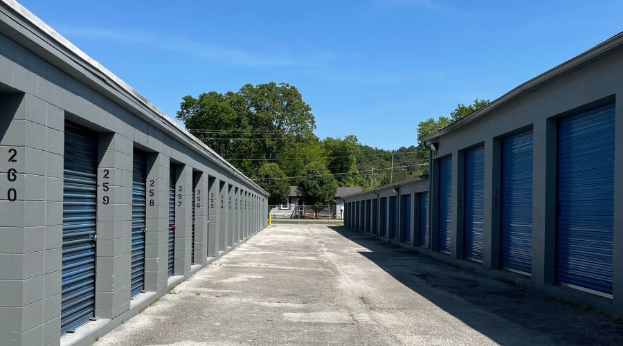 A family carrying storage boxes into their new home near KO Storage in Chattanooga, Tennessee