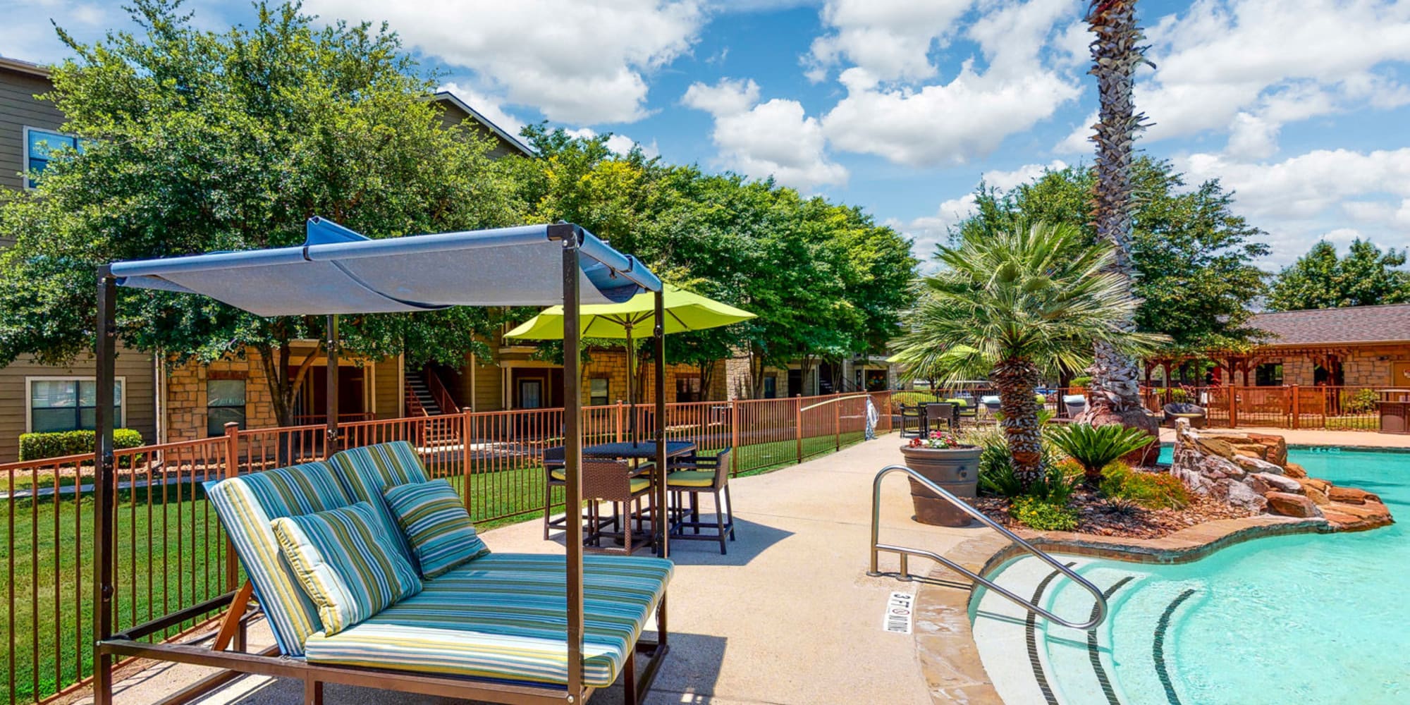 Rendering of residents swimming pool featuring sitting area at Brynwood in San Antonio, Texas