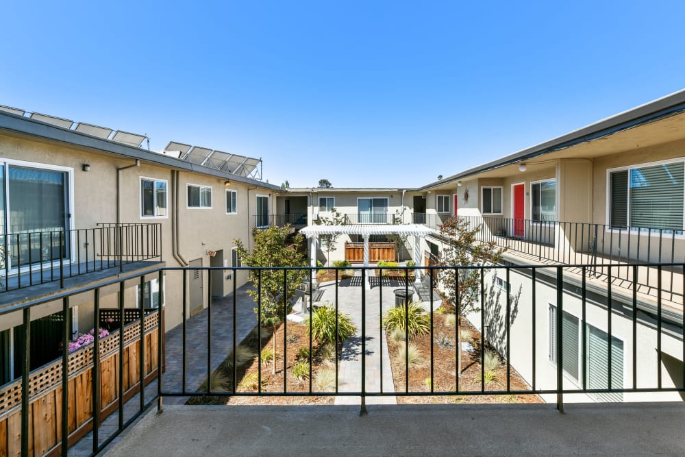 Second floor patio view of courtyard Marina Haven Apartments in San Leandro, California