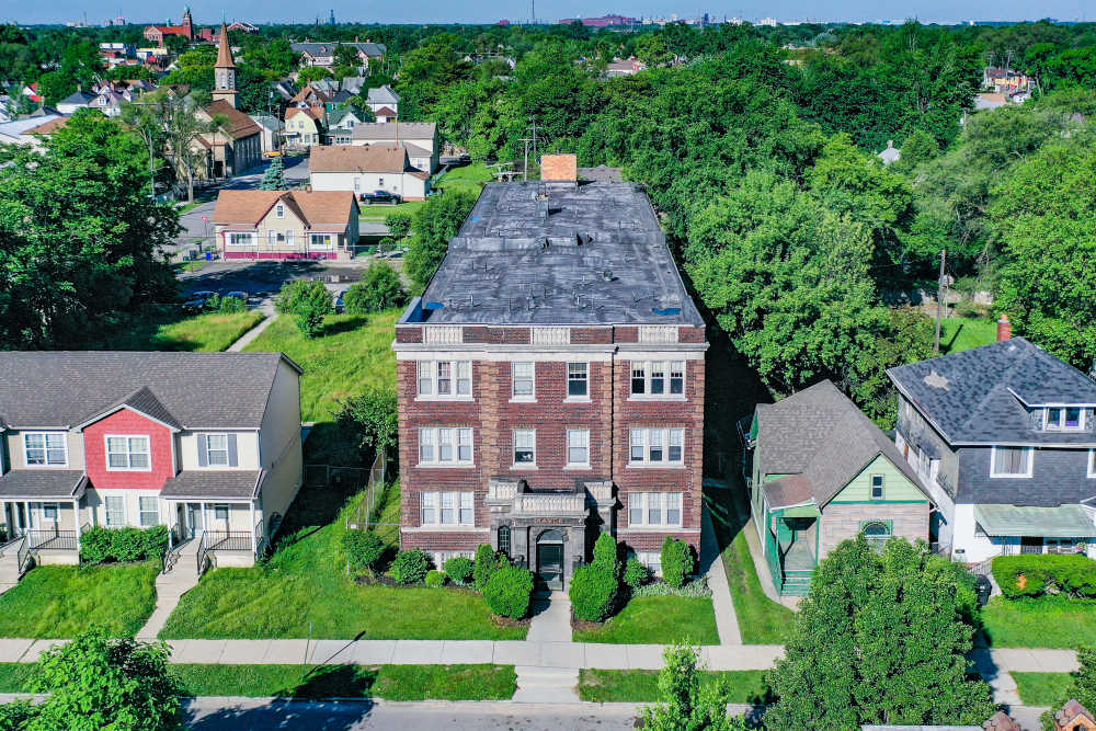 Lots of grass and walking paths around at Detroit Living in Detroit, Michigan