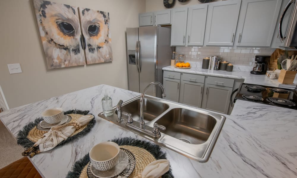 Beautiful kitchen with vast counterspace at Redbud Ranch Apartments in Broken Arrow, Oklahoma