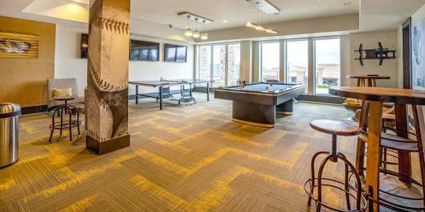 Game room with billiards at The Den in Columbia, Missouri