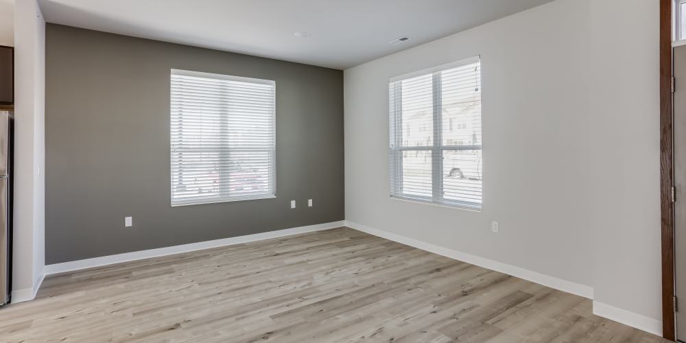 Unfurnished living room two windows at Union Court Senior Apartments and Townhomes in Kenosha, Wisconsin