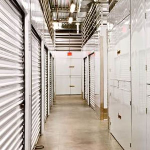 Indoor storage units with white doors at StorQuest Self Storage in Thousand Oaks, California