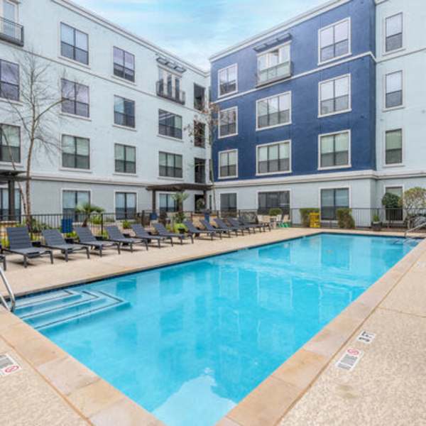 A resort style swimming pool at Briar Forest Lofts in Houston, Texas